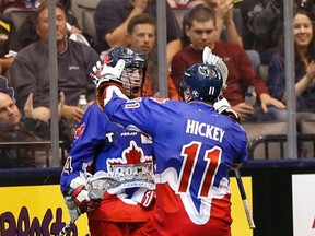 Toronto Rock Rob Marshall (14) and Brett Hickey (11) celebrate the eighth goal of the first half in their playoff game vs. The Rochester Knighthawks in Toronto on Saturday May 23, 2015. (Jack Boland/Toronto Sun)