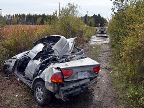 Sunday, Oct. 11, 2015 Ottawa -- The corner of McArton Rd. and Upper Dwyer Hill Rd. was the scene of a bad rollover on Sunday, Oct. 11, 2015. A 1999 Oldsmobile flipped at least once after striking a mound, sending it airborne. The vehicle came to a rest on the other side  of a swamp according to police who were at the scene.SAM COOLEY/Ottawa Sun