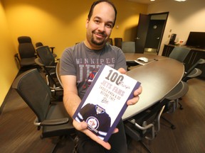 Winnipeg author Jon Waldman displays his latest book, 100 Things Jets Fans Should Know and Do Before They Die. (Winnipeg Sun/Postmedia Network)
