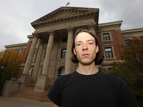 Niall Harney, treasurer for the Canadian Federation of Students – Manitoba, stands in front of the University of Manitoba administration building on Sun., Oct. 11, 2015. The group believes the $150 million the province gave the Front and Centre project does nothing to address the immediate needs of students. (Kevin King/Winnipeg Sun/Postmedia Network)