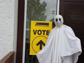 A voter arrives at an advanced poll dressed as a ghost. A Facebook group is encouraging voters to cover their faces when they vote in the federal election.
Facebook photo