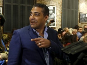 Canadian journalist Mohamed Fahmy, who was recently freed from jail in Egypt, arrives at an event at the Frontline Club in London, Britain, October 7, 2015. Fahmy, who was sentenced to three years in prison for operating without a press license and broadcasting material harmful to Egypt, was pardoned by Egypt's President Abdel Fattah al-Sisi in September. REUTERS/Peter Nicholls