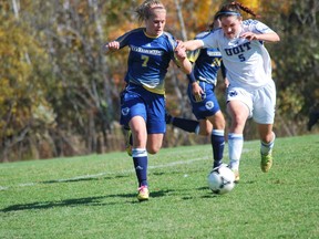 LU's Bianca Breiding battles for the ball with a UOIT player during OUA women's soccer action at the LU soccer fields on Sunday. The Voyageurs won 1-0.