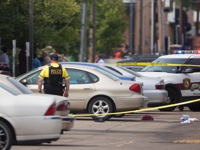 Authorities investigate a shooting at Texas Southern University, Friday, Oct. 9, 2015, in Houston. A student was killed and another person was wounded in a shooting outside a student-housing complex on Friday, and police have detained at least two people, authorities said. (Cody Duty/Houston Chronicle via AP)