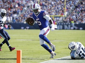 Tyrod Taylor of the Buffalo Bills tiptoes along the sideline on a 22-yard touchdown run against the Tennessee Titans in the third quarter at Nissan Stadium on October 11, 2015 in Nashville, Tennessee. (Joe Robbins/AFP)