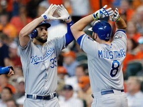 Royals first baseman Eric Hosmer (left) celebrates with third baseman Mike Moustakas (right) after hitting a two-run home run against the Astros during the ninth inning in Game 4 of the ALDS in Houston on Monday, Oct. 12, 2015. (Thomas B. Shea/USA TODAY Sports)