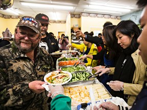 About 1,000 people attended the annual Thanksgiving dinner at the Millbourne Laundromat, on Monday. (CODIE MCLACHLAN/Edmonton Sun)