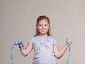 Eight-year-old Sydney Gravel  has returned from The War Amps 2015 Ontario Child Amputee (CHAMP) Seminar in Ottawa, which brought together young amputees from across the province. Sydney is pictured demonstrating how she uses a special device to skip rope.