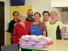Volunteers who happily come to assist in the Cochrane Community Kitchen Social include (left to right) Tina Lafrance, Denise Moorhead, George Mousseau, Elise Côté, Bev Hotte, and Claudette Fortin. Missing from the photo are Gilles Genier, Renelle Belisle, Roger Tousignant, Diane and John van Geutselaar, Sharon and Gary Martin and Jeannette Genier.