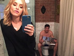 Jenny Mollen shared a selfie to Instagram on Monday showing husband Jason Biggs on the toilet in the background, but didn't realize he hadn't fully covered himself off. (Instagram photo)
