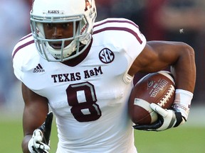 Wide receiver Thomas Johnson of the Texas A&M Aggies runs after a catch during the game against the Alabama Crimson Tide at Bryant-Denny Stadium Tuscaloosa, Alabama on Nov. 10, 2012. (Mike Zarrilli/Getty Images/AFP)