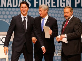 Liberal Leader Justin Trudeau, left to right, Conservative Leader Stephen Harper and NDP Leader Tom Mulcair leave the stage following the Munk Debate on Canada's foreign policy in Toronto, on Monday, Sept. 28, 2015. THE CANADIAN PRESS/POOL-Mark Blinch