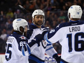 Dustin Byfuglien will be in the lineup for the Jets Tuesday night in Manhattan, after appearing to tweak his knee late in Monday's loss to the New York Islanders. (Bruce Bennett/Getty Images/AFP)