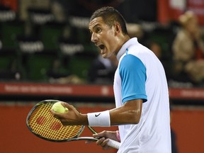 Nick Kyrgios of Australia reacts after losing a point against Benoit Paire of France during their quarter-final match at the Japan Open tennis tournament in Tokyo on Oct. 9, 2015. (AFP PHOTO/Toru YAMANAKA)