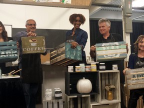 At this year's Fall Home Show,  Jennylyn Pringle from Fusion Mineral Paint (far right) challenged members of the media to show their creativity by dressing up a one-of-a-kind wooden crate.