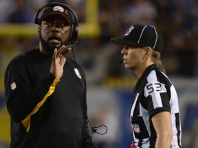 Head coach Mike Tomlin of the Pittsburgh Steelers talks to line judge Sarah Thomas during a game against the San Diego Chargers at Qualcomm Stadium in San Diego on Oct. 12, 2015. (Donald Miralle/Getty Images/AFP)