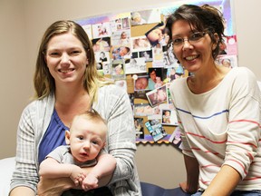 Lindsay Ottens and Amy Callahan, registered midwives at Midwifery Services of Lambton Kent, are pictured with Ottens' three-month-old son Daniel Scott. The duo talked recently about midwifery being on the rise in Ontario. (Tyler Kula/Sarnia Observer/Postmedia Network)