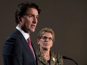 Liberal Leader Justin Trudeau and Ontario Premier Kathleen Wynne take part in a joint news conference in Ottawa, Thursday, January 29, 2015. (THE CANADIAN PRESS/Adrian Wyld)