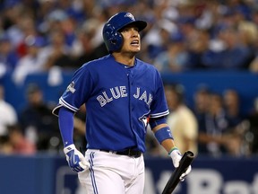 Ryan Goins of the Toronto Blue Jays reacts after striking out in the seventh inning against the Texas Rangers during Game 2 of the American League Division Series at Rogers Centre in Toronto on Oct. 9, 2015. (Vaughn Ridley/Getty Images/AFP)