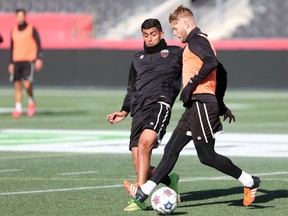 Ottawa Fury FC forward Aly Hassan, left, and captain Richie Ryan train at TD Place on Thursday, Oct. 9, 2015. (Chris Hofley/Ottawa Sun)