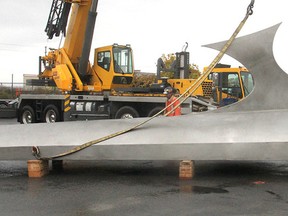 A piece of a 13-metre, 16-tonne steel iceberg is lifted onto a truck on Tuesday for the trip to the Canadian Museum of Nature in Ottawa. Michael Lea/The Whig-Standard/Postmedia Network