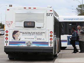 Transit users board the Route 47 Transcona bus on Regent Avenue. (Kevin King/Winnipeg Sun file photo)