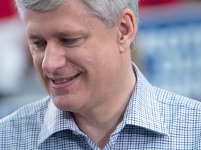 Conservative Leader Stephen Harper pauses for a moment as he attends a campaign event at William F. White International in Etobicoke Tuesday, Oct. 13, 2015. (THE CANADIAN PRESS/Jonathan Hayward)