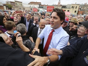 Liberal leader Justin Trudeau greets supporters during a campaign stop in Stratford, Ontario October 13, 2015. REUTERS/Chris Wattie