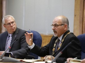 JASON MILLER/The Intelligencer
Mayor Taso Christopher (right) speaks as Coun. Jack Miller looks on, Monday, during a city council meeting a city hall.