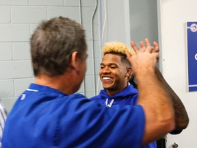 Blue Jays manager John Gibbons gets a high five from Marcus Stroman at the Rogers Centre on Tuesday. (Michael Peake/Toronto Sun)