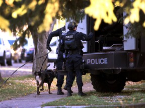 City police blocked off a portion of 76 Avenue for several hours Tuesday as they searched for a suspect with warrants. The standoff ended later Tuesday. (Perry Mah/EDMONTON SUN)