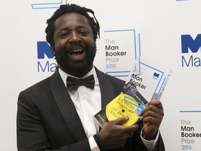 Marlon James, author of "A Brief History of Seven Killings", poses for photographers after winning the Man Booker Prize for Fiction 2015 in London, Britain October 13, 2015. REUTERS/Neil Hall