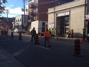 City workers along Elgin St. Wednesday morning, where a water main break has caused lane reductions near Waverly through the morning commute. There is no ETA for repairs. (DANI-ELLE DUBE Ottawa Sun)