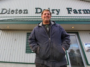 Derek Van Dieten stands in front of his barn that produces approximately one million litres of milk yearly. He plans to donate 100 litres of milk for every home run hit by the Blue Jays.(Shaun Gregory/Huron Expositor)