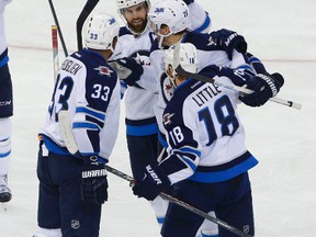 Winnipeg Jets centre Bryan Little (18) celebrate with teammates after scoring a goal against the New York Rangers during third period at Madison Square Garden Oct. 13, 2015. The Winnipeg Jets defeated the New York Rangers 4-1.
