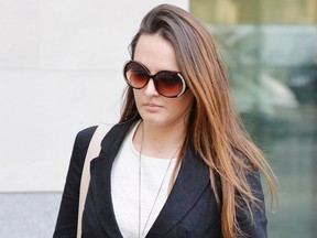 Meerkat expert Caroline Westlake leaves Westminster Magistrates Court after being sentenced to 80 hours community service for glassing a love-rival, in London,  Wednesday Oct. 14, 2015. A former meerkat expert at London Zoo has been ordered to pay compensation to a monkey handler she attacked with a wine glass in a love spat over a llama-keeper. A judge at Westminster Magistrates' Court said Wednesday that Caroline Westlake must pay 800 pounds ($1,235) to Kate Sanders for assaulting her in a dispute over colleague Adam Davies, who had dated both women. (John Stillwell/PA via AP)