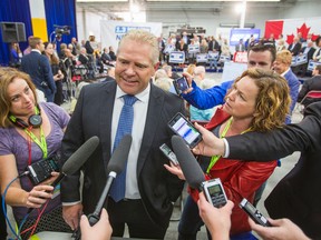 Doug Ford scrums with the media at a campaign event for Conservative Leader Stephen Harper in Etobicoke on Tuesday, Oct. 13, 2015. (ERNEST DOROSZUK/Toronto Sun)