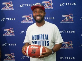 Newly-acquired Alouettes quarterback Kevin Glenn poses for the cameras following a news conference in Montreal on Wednesday, Oct. 14, 2015. (Graham Hughes/THE CANADIAN PRESS)