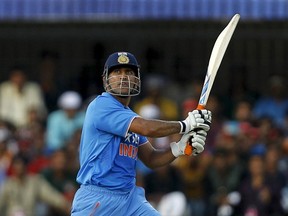 India's captain Mahendra Singh Dhoni hits a shot during their second one-day international cricket match against South Africa in Indore, India, on Wednesday. Danish Siddiqui/Reuters)