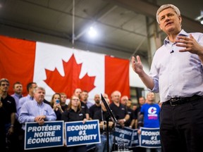Prime Minister and Conservative leader Stephen Harper speaks at a campaign event at J.P. Bowman, a tool and die facility, in Brantford, Ontario, October 14, 2015. (REUTERS/Mark Blinch)