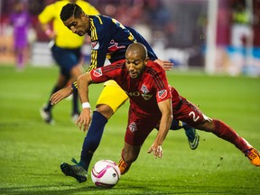 Toronto FC's Justin Morrowbattles against New York Red Bulls' Gonzalo Vernon on Wednesday at BMO Field. (Aaron Vincent Elkaim/The Associated Press)