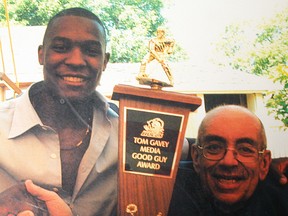 The late Tom Gavey presents the inaugural Tom Gavey Media Good Guy Award to former Belleville Bulls star Nate Robinson in 2002. (Intelligencer file photo by Paul Svoboda)