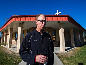 Pastor Brian Allan speaks to the Sun outside Withrow Gospel Mission in Withrow, Alta. on Wednesday, Oct. 14, 2015. Three girls died after being buried in grain. The girls were playing on a grain truck loaded with canola. Allan is a close friend of the family. Codie McLachlan/Edmonton Sun/Postmedia Network