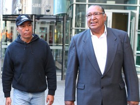 William Okeynan (L) and Derwin Okeynan (R) leave the Calgary Courts Centre in Calgary, Alta on Wednesday October 14, 2015.  They attended the murder trial where Gabriel Okeynan (William's brother, Derwin's nephew) was stabbed to death near Marlborough Mall on June 20, 2014. Jim Wells/Calgary Sun/Postmedia Network