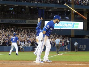 Blue Jays outfielder Jose Bautista flips his bat after hitting a three-run home run against the Rangers during Game 5 of the ALDS in Toronto on Wednesday, Oct. 14, 2015. (Stan Behal/Toronto Sun)