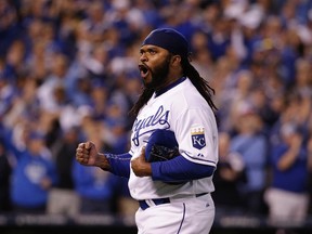 Royals starting pitcher Johnny Cueto reacts as he walks off the field after pitching in the eighth inning of Game 5 of their AL Division Series against the Astros in Kansas City, Mo., on Wednesday, Oct. 14, 2015. (Charlie Riedel/AP Photo)