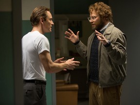 In this image released by Universal Pictures, Michael Fassbender, left, and Seth Rogen appear in a scene from, "Steve Jobs." (Francois Duhamel/Universal Pictures)