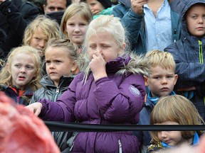 Children reacts to the dissection of a dead male lion in Odense Zoo, Denmark, Thursday, Oct. 15, 2015.  (Ole Frederiksen/Polfoto via AP)