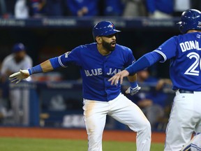 Blue Jays' Jose Bautista celebrates after hitting a three-run home run in the 7th inning against the Texas Rangers in game five of the American League Division Series in Toronto Wednesday October 14, 2015. (Dave Abel/Toronto Sun)