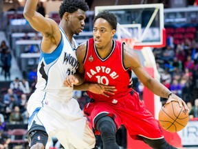 Minnesota Timberwolves forward Andrew Wiggins blocks Toronto Raptors guard DeMar DeRozan in a pre-season matchup at the Canadian Tire Centre. (Marc DesRosiers/USA TODAY Sports)